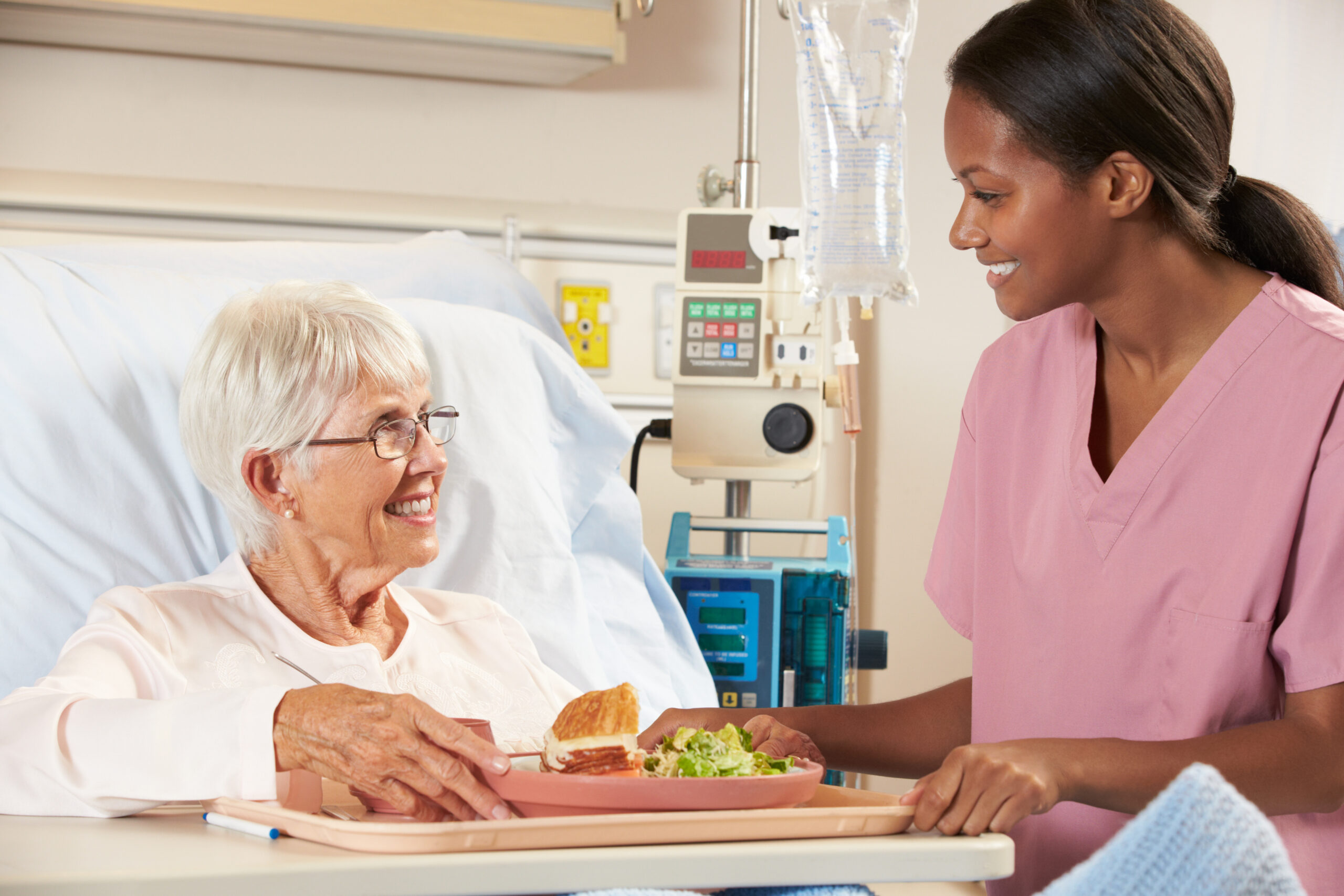 Nurse feeding geriatric patients. Geriatric Nutrition: The Importance of Nutrient Density for Older Adults